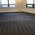 This is a photo of a grey office carpet that has just been professionally steam cleaned works carried out by Abbots Langley Carpet Cleaning